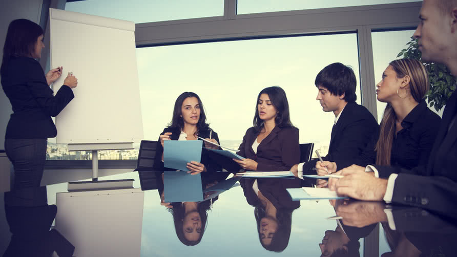 latin woman during boardroom presentation