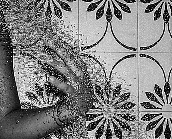 woman taking shower black and white