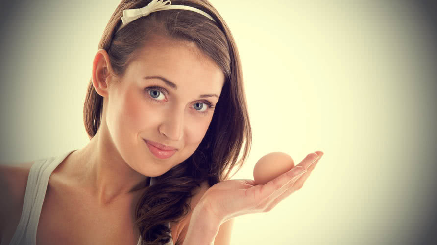 Girl holding an egg
