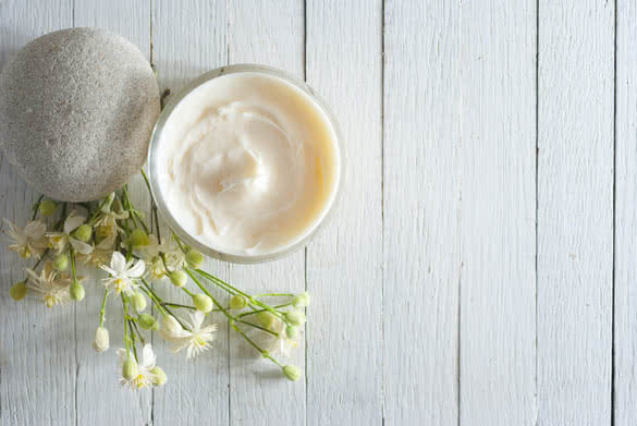 cosmetic cream with herbal flowers