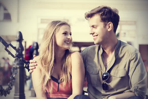 young couple smiling and looking at each other