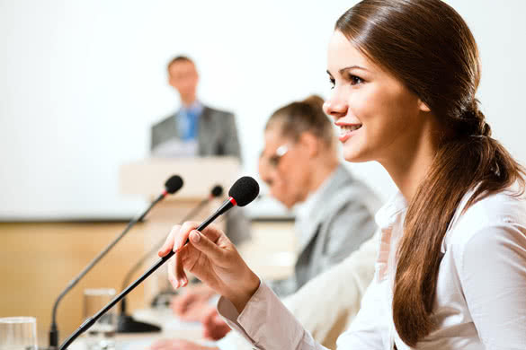 Public-Speaking-woman-sitting-at-the-table.jpg