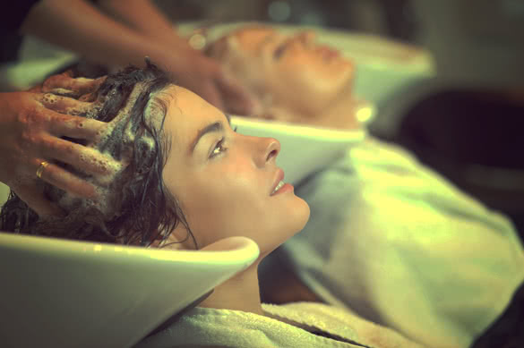beautiful woman getting a hair wash