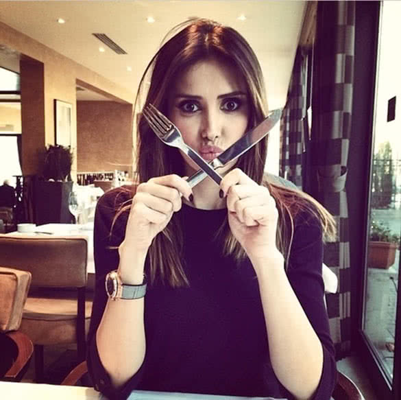 beautiful woman having a lunch at the restaurant alone