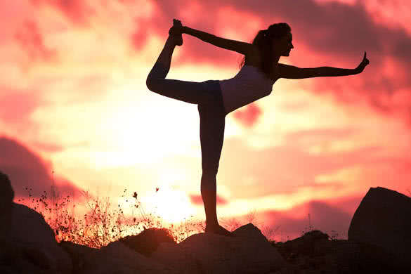 sunset yoga woman on sea coast