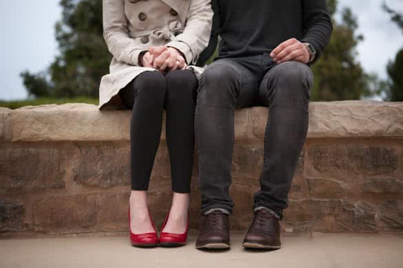 couple-sitting-and-holding-hands