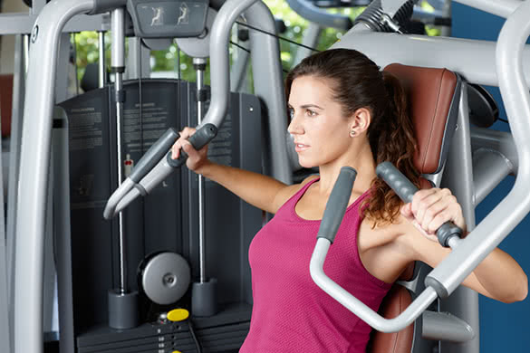 woman-exercising-with-machine-at-the-gym