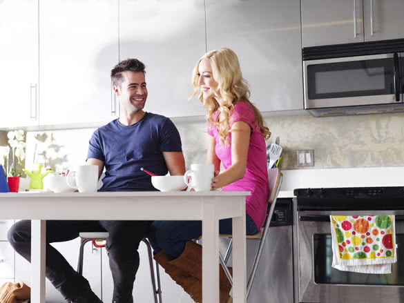 couple at home eating breakfast at table