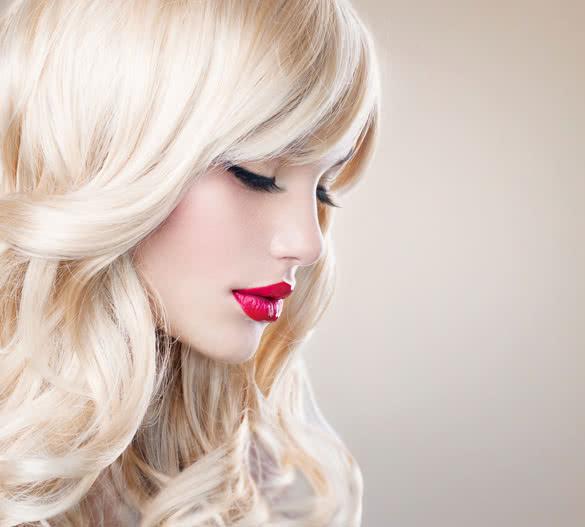 Beautiful Blond Girl with Healthy Long Wavy Hair