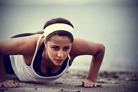 brunette woman doing push ups