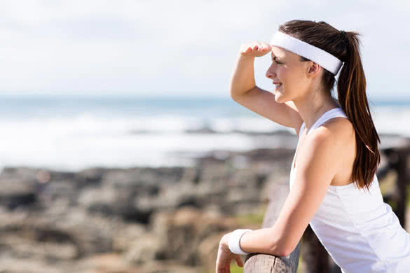 pretty woman after morning exercise at the beach