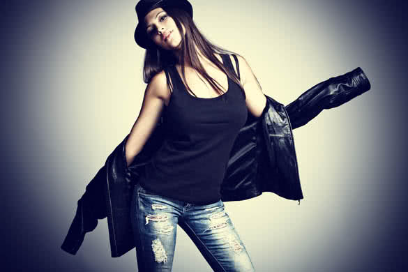young woman in leather jacket and hat