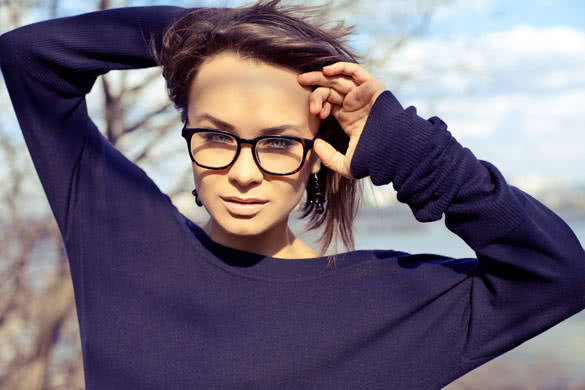 Beauty portrait of attractive young lady in glasses