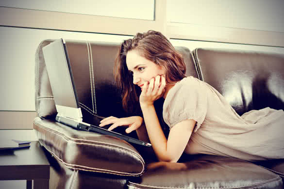 beautiful woman using a laptop casual still life