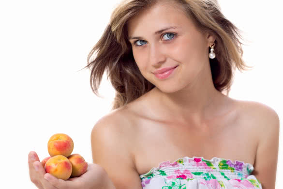 cute girl offers apricot