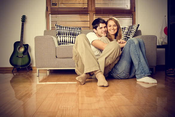 smiling couple in living room