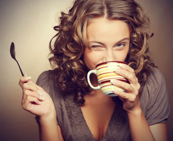 wavy hair woman drinking coffee