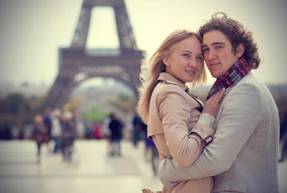 Romantic couple in Paris by the Eiffel Tower