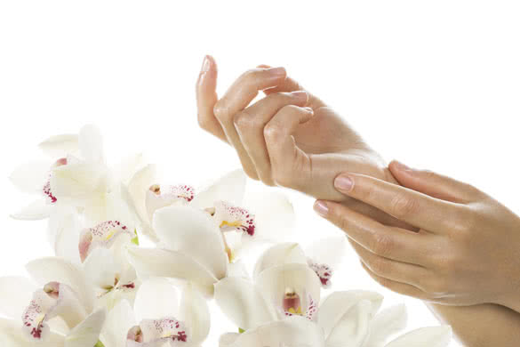 Woman applying cream on her hands