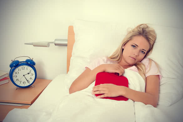 Young Sick Woman in Bed