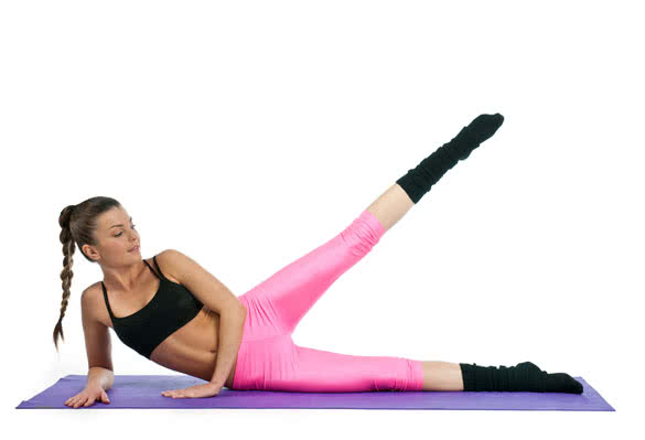 attractive woman stretching leg exercise on the floor