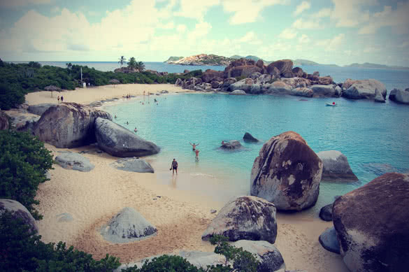crescent beach with granite boulders and turquoise waters