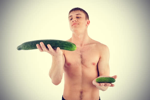 guy holding cucumbers
