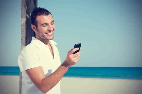 smiling guy texting