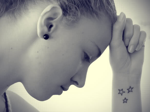 blonde woman with 3 stars tattoo