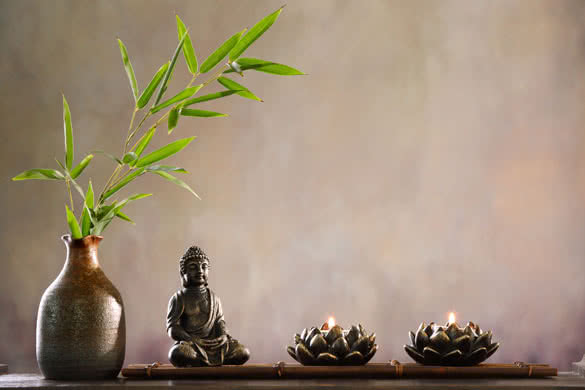 Buddha with candle and bamboo