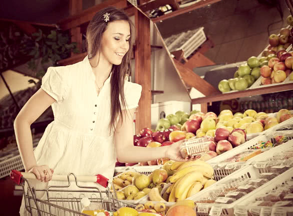 The Girl choose food in supermarket