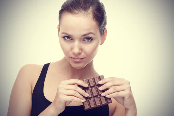 Woman holding bar of chocolate
