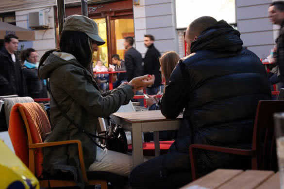 couple sitting in the street cafe