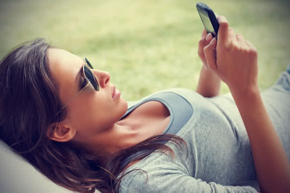 girl with sunglasses texting