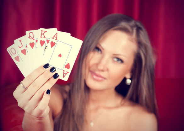 pretty girl showing play cards