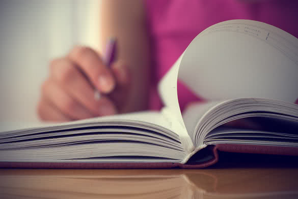 woman writing in journal