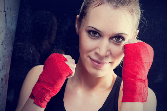 Boxing training blond woman sparring and sweating