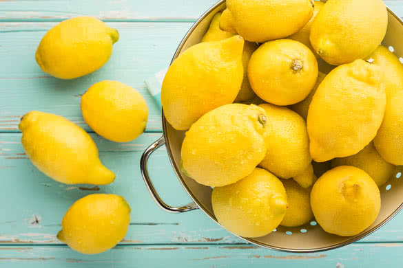 Fresh lemons in retro colander