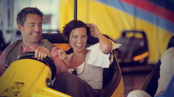 young couple having fun in fun park