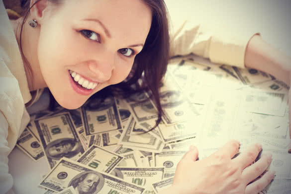 young woman with the money on a white background