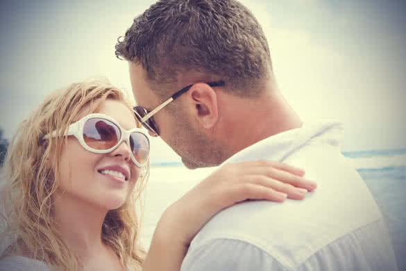 lovely couple with sunglasses smiling