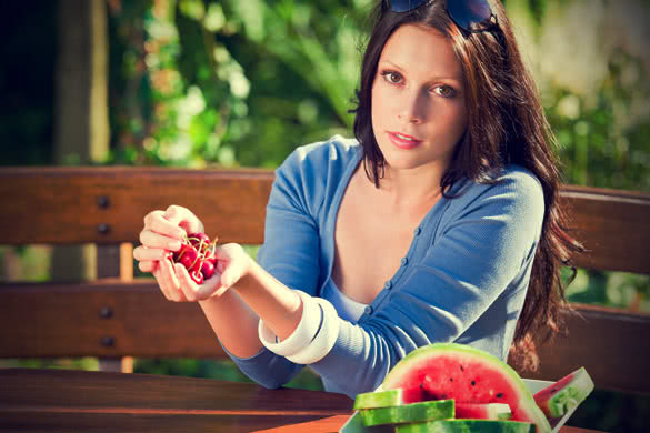 Woman in blue shirt and watermelon