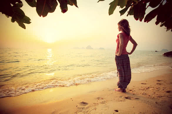 Young woman relaxing on a tropical beach