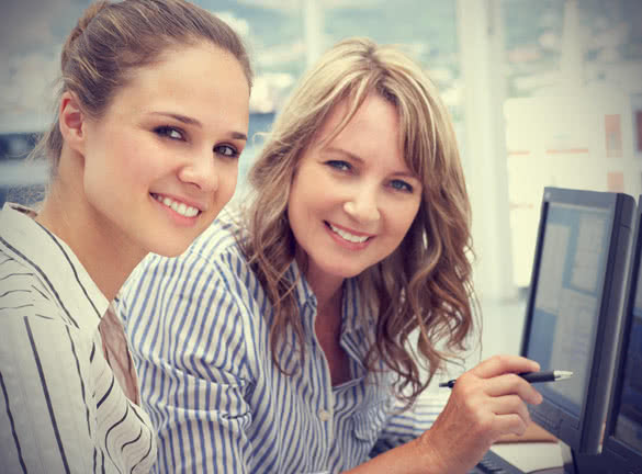 businesswomen working on computers