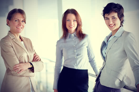 3 successful businesswomen looking at camera
