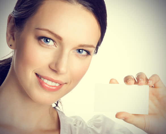Woman with Blue Eyes Holding Business Card