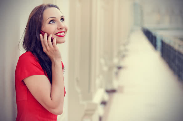 beautiful young woman having a phone call