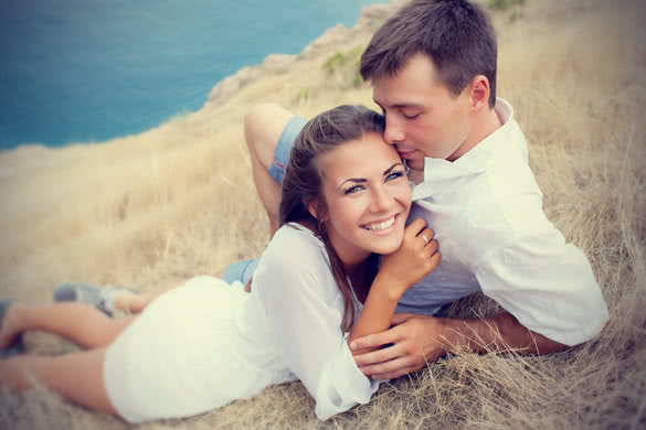 happy young couple enjoying in nature