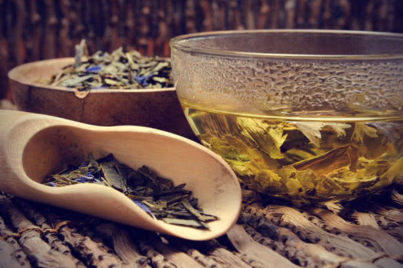 Tea composition with mint leaf on wooden palette