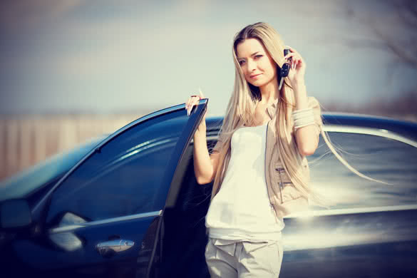 beautiful girl with car key in hand